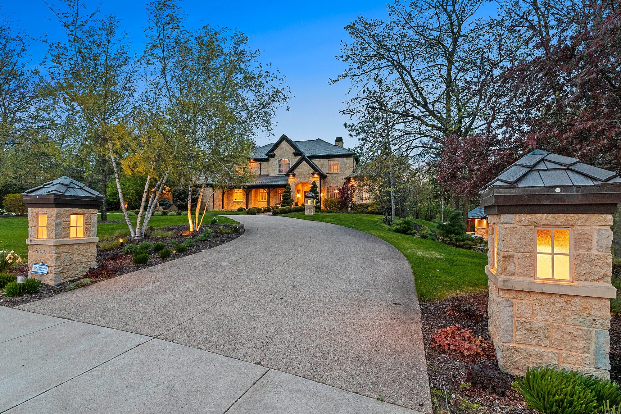 Cobblestone driveway entrance at dusk