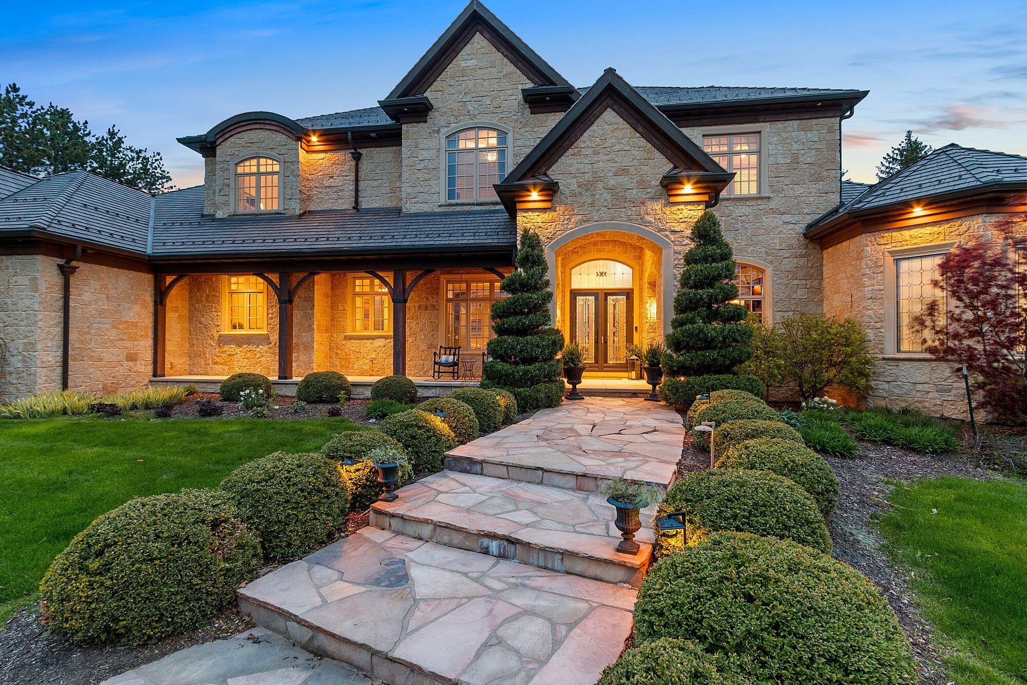 Flagstone walkway and front entry at dusk