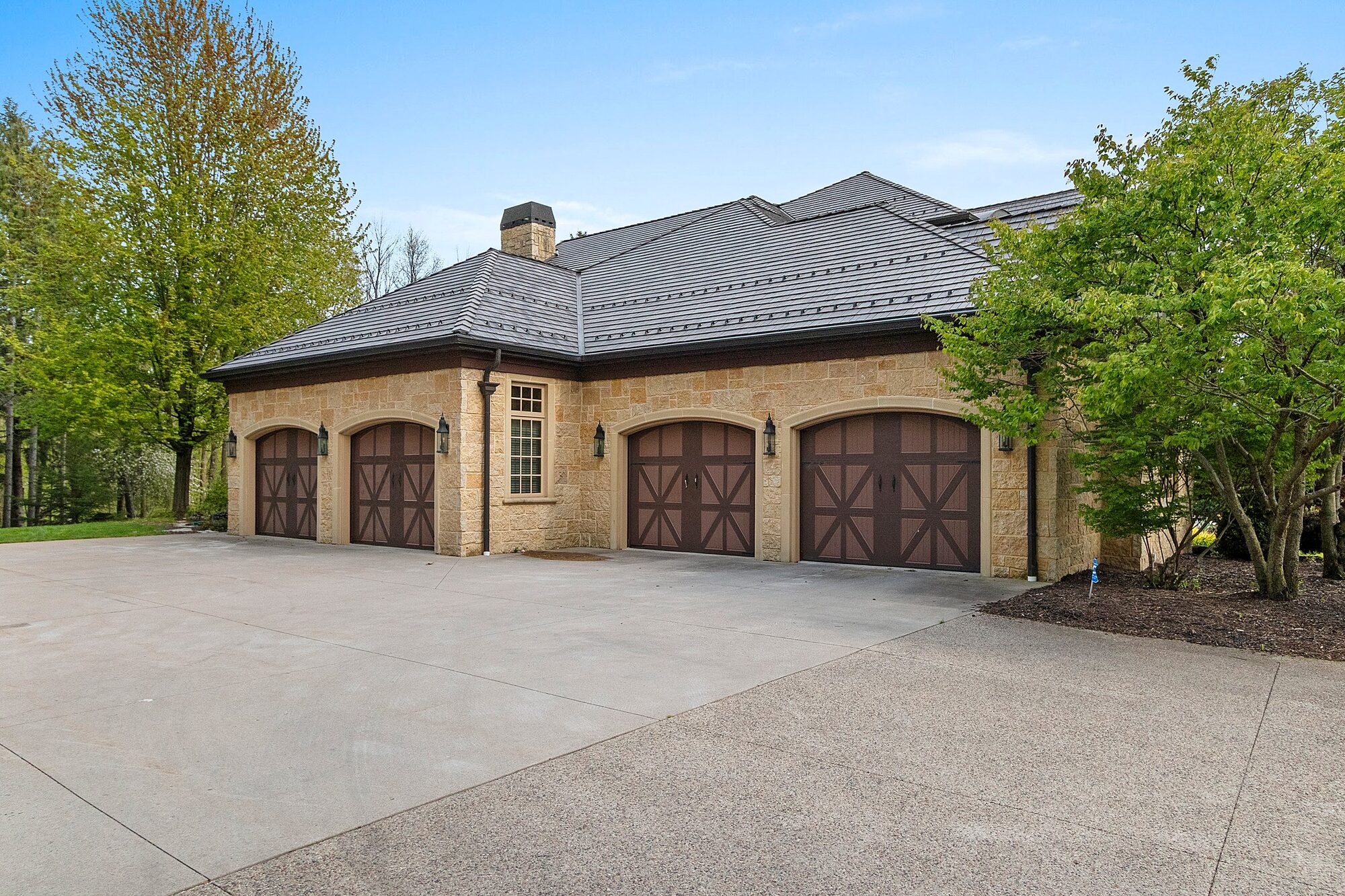 Four car garage with stone exterior
