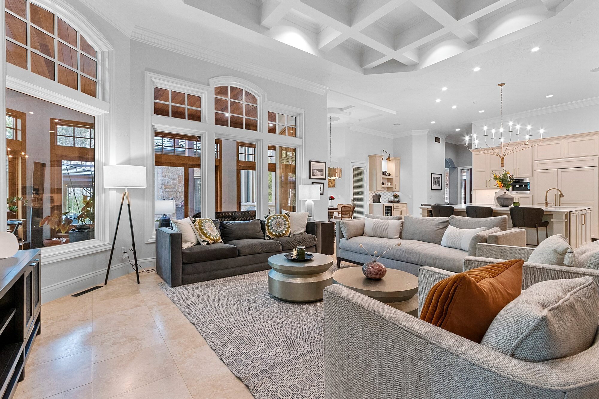 Open concept great room with coffered ceilings